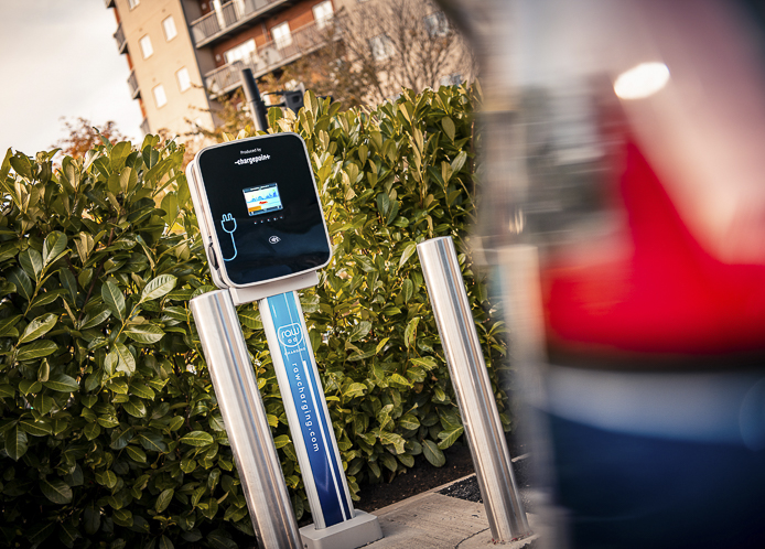 An electric vehicle charging port on the side of the road