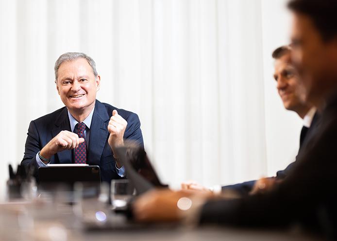 Antin CEO Alain Rauscher in a meeting with two other men